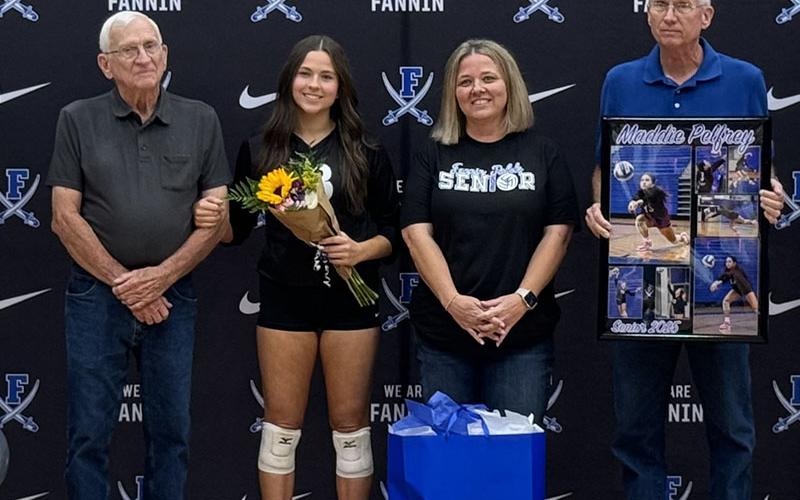 Maddie Pelfrey  is shown with Larry, Velda and Donnie Pelfrey, her escorts when the Fannin County Lady Rebels celebrated Volleyball Senior Night.