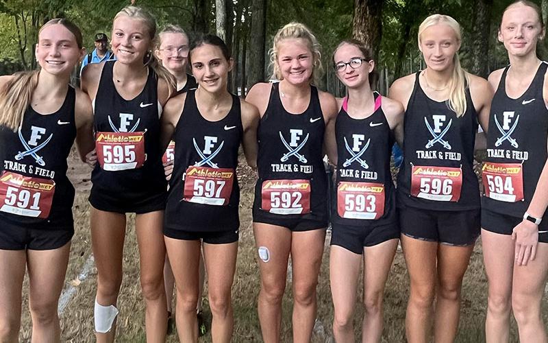 Lady Rebels cross country competitiors shown following the AT&amp;T Starr’s Mill Panther Cross meet are, from left,  Lila Borum, Lindsey Holloway, Claire Saxon (in back), Karli Sams, Annaleigh Cheatham, Sydney Ford, Kensley Pickelsimer and Lana Hicks.