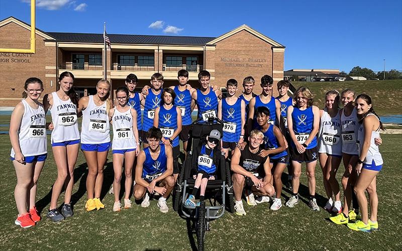The Fannin County High School boys and girls cross country teams are shown after their first place wins at Banks County last week. The teams included, from left, standing, are Claire Saxon, Lana Hicks, Kensley Pickelsimer, Sydney Ford, Henry Scheuneman, Ryliin Davis, Joe DiBenedetto, Austin Prieto, Hudson Lynch, Kaden Majors, Gavin Davis Jaxson Bittner, Brodey Angel, Aiden Jones, Annaleigh Cheatham, Lindsey Holloway and Karli Sams; and, kneeling, Matthew Ponton, Brady Smith, Gage Bryan and Kevin Cruz.
