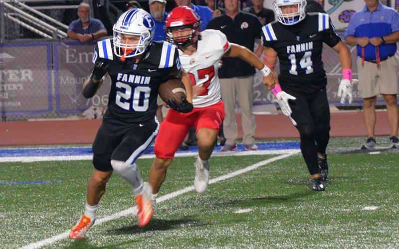 Fannin County’s Braxton Cheatham (#20) escaped the clutches of this Chattooga tackler in action Friday night in Blue Ridge. Fannin’s Rebels hosted the Indians in a region matchup that included Georgia’s top ranked running back in Class 1A. The Rebels post a 35-7 win to hold onto their grip as Region 7A’s first place team.