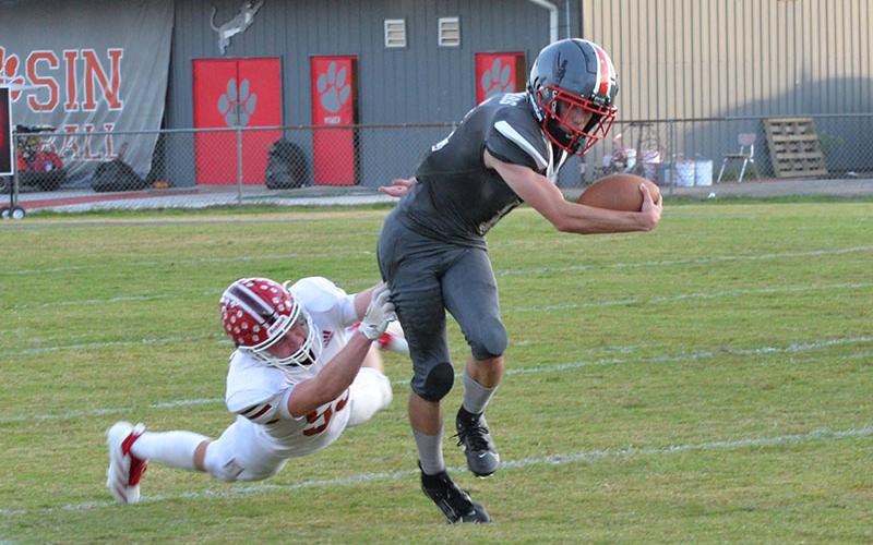 Copper Basin’s Lucas Hughes escapes the grasp of a Whitwell tackler last Monday. Against Mt. Bethel Christian Academy Friday night, Hughes ran for 110 yards and scored one of the Cougars’ three touchdowns.