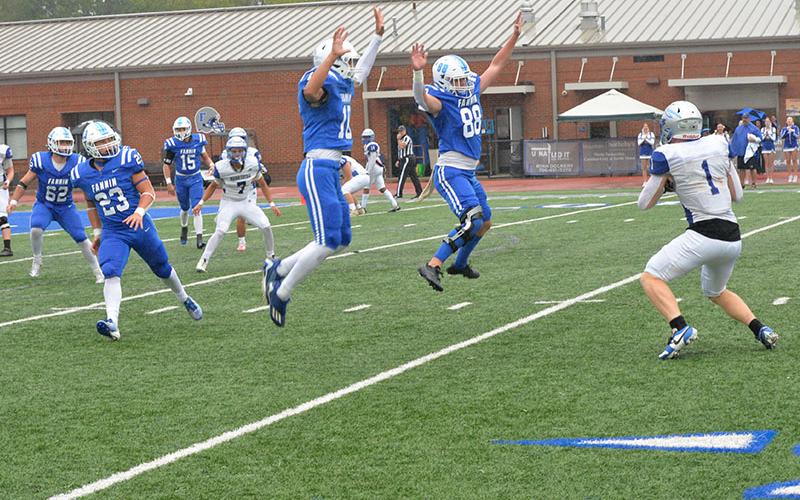 Fannin County’s Luke Holsonback (#10) and Noah Burnette (#88) jump high in the air to break up a Gordon Central pass at Fannin County field Saturday. In coverage for the Rebels are C.J. Reece (#23), Case Holloway (#62) and Scott Waldrep (#15). The Rebels won the region contest 38-6 in front of the homecoming crowd.