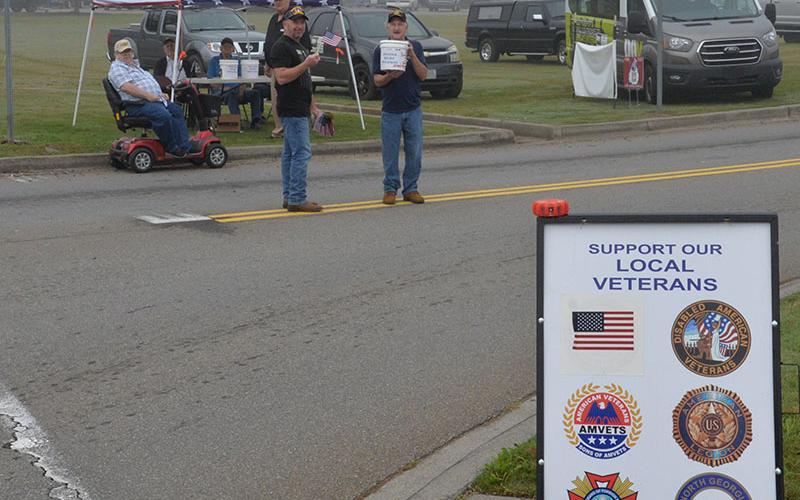Fannin County veterans organizations had planned a fund raising drive at Walmart and other Blue Ridge locations this past Saturday to support their local efforts. However, due to the extreme need in western North Carolina, the groups chose to donate everything they could collect to the relief effort. Here, the Saturday’s early morning fog still hasn’t lifted as veterans start their day long effort.