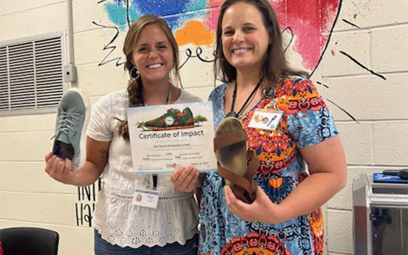 Brittany Todd, EFES STEM teacher (left), and Kayleigh O’Neal, EFES 2nd grade teacher, participated in East Fannin Elementary’s shoe drive fundraiser.