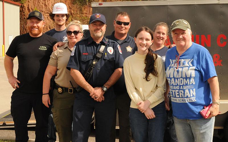 Representatives of the  Fannin County Emergency Management Agency and Fannin County Sheriff’s Office rallied together with community support to collect items to provide to Western North Carolina following devastation from Hurricane Helene’s tropical storm. Lending a hand last week are, from left, Gene McClure, Noah Turner, Sergeant Jill Huffman, EMT Robert Poole, Captain Justin Turner, EMT Tonya Gregory, donor Rylee Kenniff and donor Jody Guttridge.