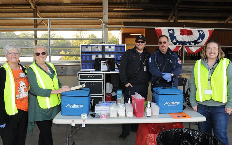 The North Georgia Health District held their annual Drive-Thru Flu Shot Clinic Tuesday, October 8, at the Blue Ridge Farmer’s Market. Set up and ready to help administer shots are, from left, Beneta Haywood, Teresa Ellis, Hunter Patterson, Bill Brown and Ashley Deverell.