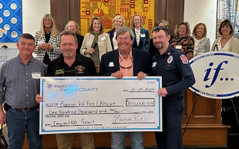 Representing Fannin County Volunteer Fire and Rescue as they accept their donation from Impact100 Fannin are, from left, Fannin County Commission Chairman Jamie Hensley, Fire Chief Larry Thomas, Rick Glueckert and Michael Cornelius.