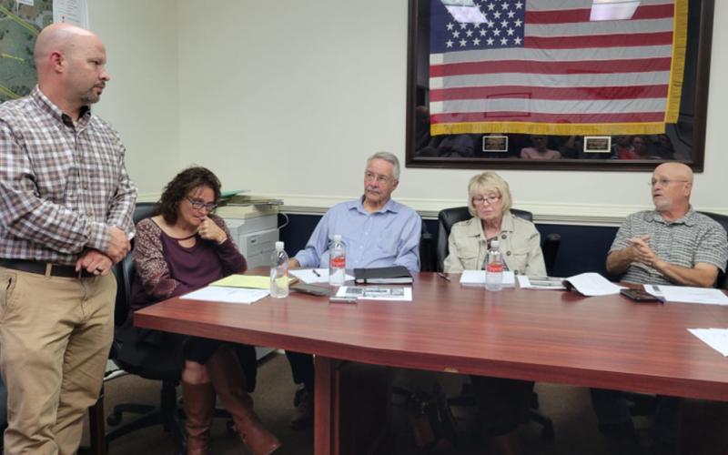 Georgia Department of Transportation District Engineer Grant Waldrop answers a question from Mayor Terry Arp. Shown during the McCaysville City Council meeting last week are, from left, Waldrop, Deputy Clerk Denise Queen, city council members Billy Wayne Chastain and Gilita Carter and Arp.