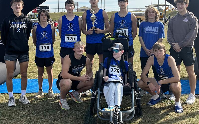 The Fannin County Rebels cross country team is the Region Runner-Up, a title they earned at the Sectional meet this past Saturday. Displaying their trophy are, from left, standing, Matthew Ponton, Joe DiBenedetto, Henry Scheuneman, Hudson Lynch, Austin Prieto, Aiden Jones and Brodey Angel, and, kneeling, Gage Bryan, Brady Smith and Rylin Davis.