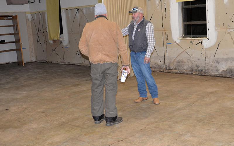 Polk County Executive Robby Hatcher shows Copper Basin Fire Chief Marty Senterfitt the progress being made at the Copper Basin Community Center.