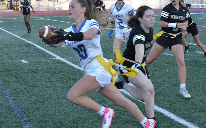 Makenzie Duvall reaches for as much yardage as possible for the Fannin County High School flag football team.
