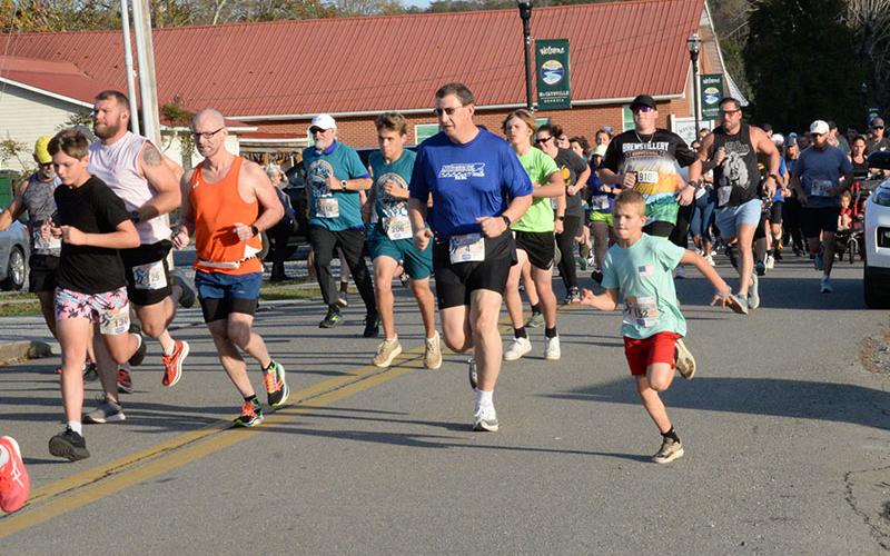 The Riverwalk Run Series is a group of three, 5K races that covers two states and attracts a wide variety of runners. This group has just left the starting line at the November 2 Bigfoot Boogie.