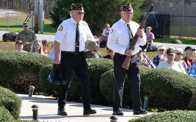 The placing of the rifle, helmet and boots, remembering those who paid the ultimate price, was a somber part of the Veterans Day ceremony.