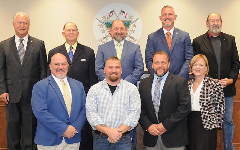 Fannin County High School teacher Terry Flowers, front, second from right, was recognized during the Fannin County Board of Education’s November 14 meeting for being chosen to participate in a state program. Flowers is shown with, from left, front, Assistant Principal David Henson, Principal Dr. Scott Ramsey and Superintendent Shannon Dillard; and, back, board members, Terry Bramlett, Bobby Bearden, Mike Cole, Chad Galloway and Lewis DeWeese.