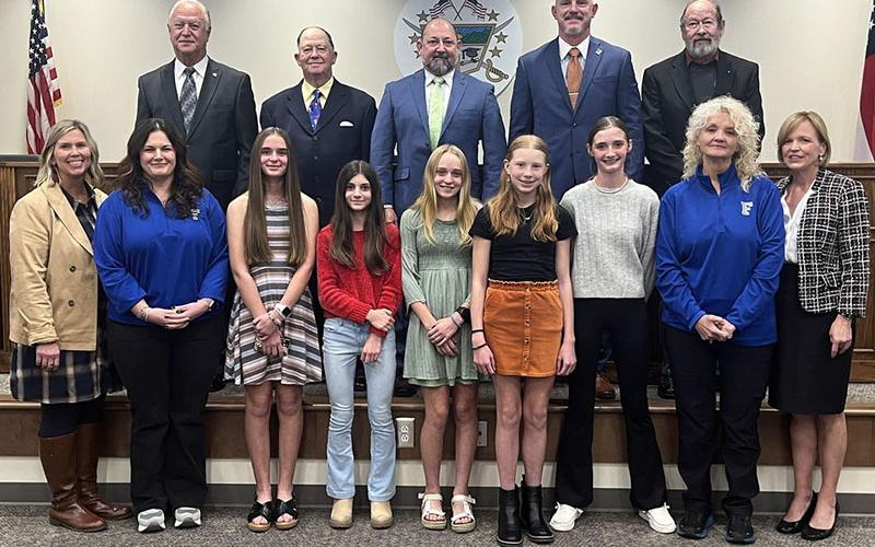 The Fannin County Middle School girls Cross Country team are the state runners up, and because of this accomplishment, they were recognized during the board of education’s November 14 meeting. Due to other obligations, the full team was not present, but shown are, from left, front, Principal Dr. April Hodges, Jenna Saxon, Mallory Cline, Karrissa Martin, Jacqueline Cline, Nathalie Sowers, Lola Temples and Coach Cindi Barnes; back, board members Terry Bramlett, Bobby Bearden, Mike Cole, Chad Galloway and Lewi