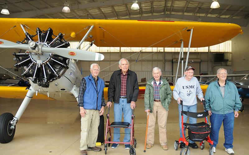 Veterans and residents of Blue Ridge Assisted Living and Memory Care Andrew Moses, Vernon Chesser, Bill Langford, Joel “Hatch” Hatchell and Jim Nelson, from left, were treated to a “Dream Flight” aboard a World War II-era Stearman biplane.