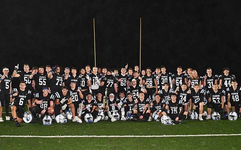 The Fannin County Rebels proudly display the Region Championship trophy after their win Friday night over the Gordon Lee Trojans.