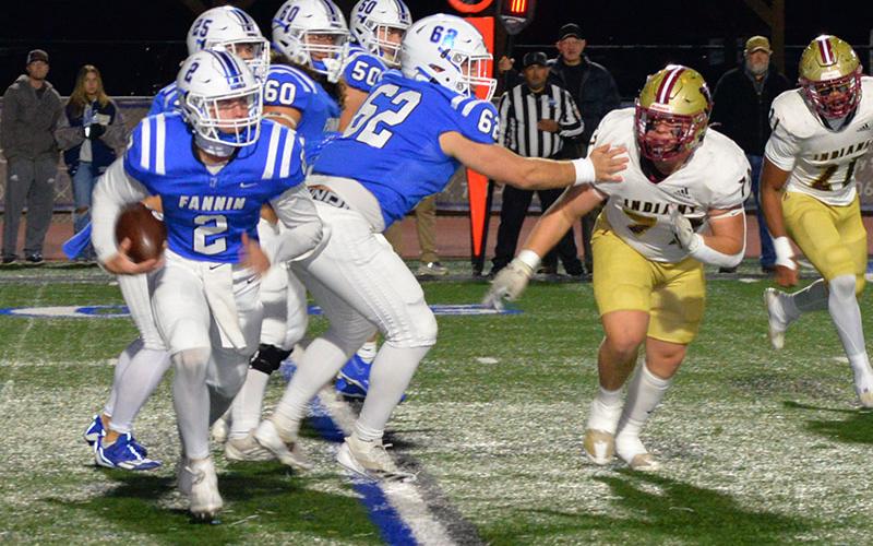 Fannin County’s Lawson Sullivan (2) looks for room downfield. Just as they have countless times this season, clearing a path are, from left, Carson Callihan (25), Case Holloway (62), Jacob Dye (60) and Isaac Watkins (50).