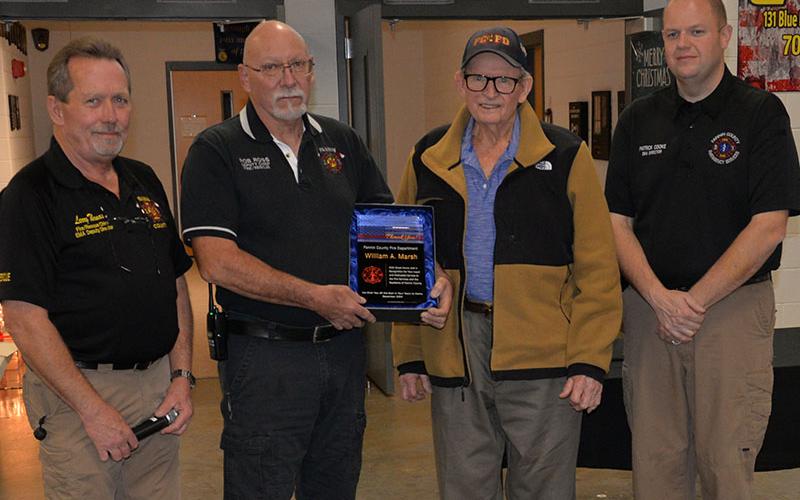 Bill Marsh was honored for his years of service and many contributions to the Fannin County Fire Department. Presenting the award were, from left, Fire Chief Larry Thomas, Assistant Fire Chief Rob Ross, Marsh and Emergency Management Agency Director Patrick Cooke.