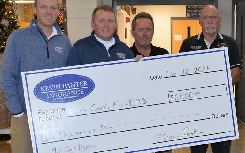 Kevin Panter Insurance produces the blue 911 emergency address signs for area residents and then donates the proceeds from the sale of those signs to the Fannin County Fire Department. During the annual fire department dinner, a check for $6,000 was presented from the community effort. Shown are, from left, Austin Panter, Kevin Panter, Fire Chief Larry Thomas and Assistant Chief Rob Ross.