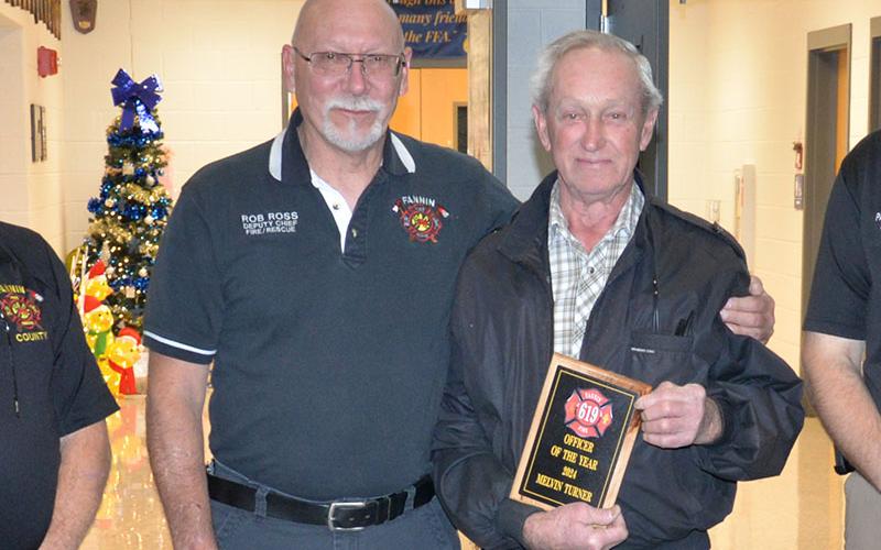 Station Captain Melvin Turner, right, received the Officer of the Year award from Assistant Fire Chief Rob Ross. Turner is over Station 9 in Suches. He has been a volunteer with the Fannin County Fire Department since 1996.