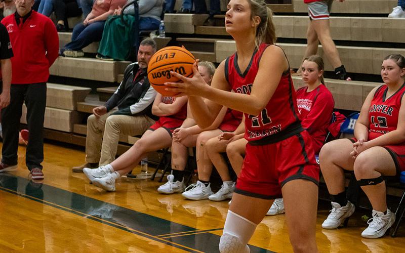 Alexis Hyatt (21) takes aim for seven of the points she scored for Copper Basin against Hiwassee Dam.