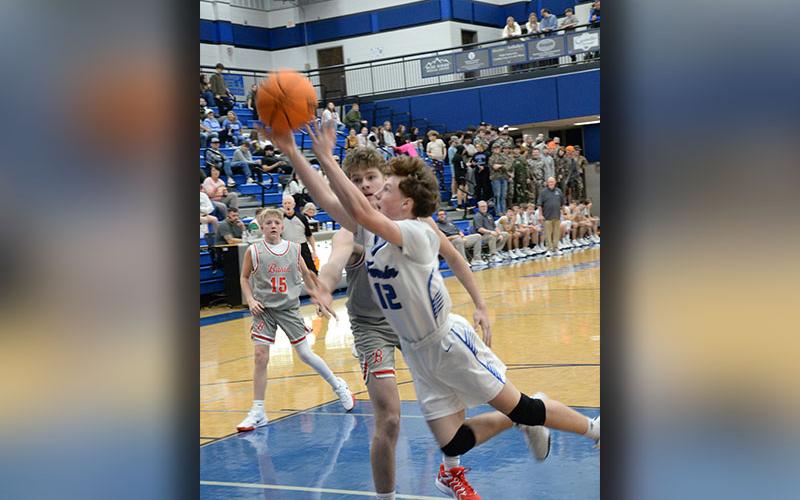 Fannin County’s Jasper Mealer (12) stretches for a basket against the Copper Basin Cougars in action Tuesday night, December 17, at the Fannin County High School gym.