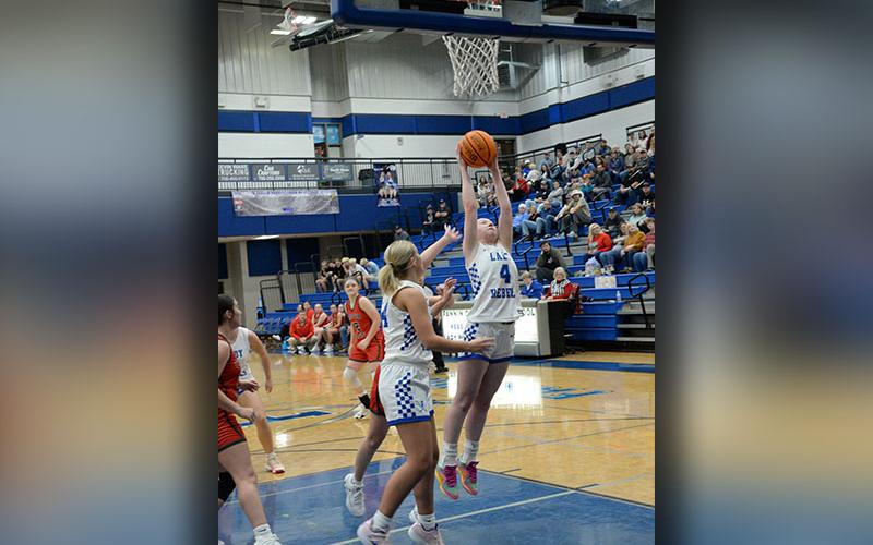Fannin County’s Emma Buchanan (4) stretches for a rebound against Copper Basin Tuesday night, December 17. Backing her up is Emma Holloway.