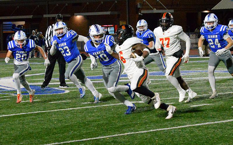 Fannin County’s Braxton Cheatham (20), CJ Reece (23), Luke Holsonback (10), Cooper Born (14) and Cooper Hillard (24) chase down Northeast High School’s Nick Woodford (6) in Friday night’s Elite Eight match up on the Fannin County High School football field. The Fannin defense has been an anchor for the Rebels’ 12-1 season.