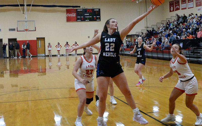 Fannin County’s Reese Lewis (22) stretches for a rebound against Copper Basin’s Zoe Green (23) in action last Friday night at Copper Basin. Lewis scored 21 points to lead Fannin to a 61-36 victory.
