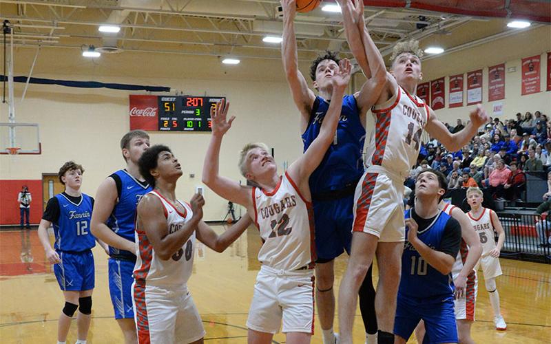 Fannin County’s Brody Henson and Copper Basin’s Talon Smith (14) battle for a rebound last Friday night along with Basin’s Drew Crowder (12) and Darrius Harris (50), and Fannin’s Holden Eavenson (10).