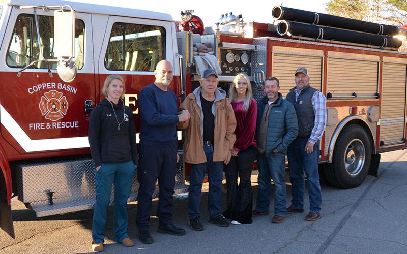 Shown during the presentation of the keys are, from left, Dr. L.B. Bryson of the CBFD, CBFD Fire Chief Marty Senterfitt, Third District commissioners Mush Davis, Samantha Trantham and Keith Barker, and County Executive Robby Hatcher. The truck will be housed at the Grassy Creek station.