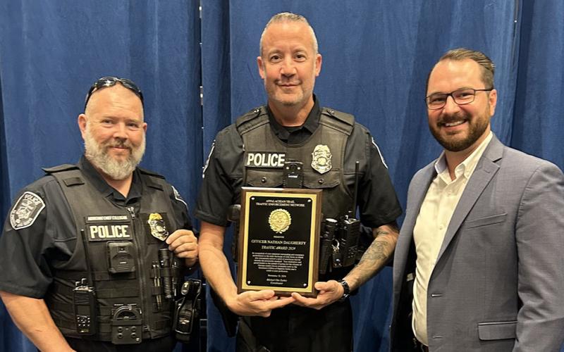 McCaysville Police Officer Nathan Daugherty, center,  is shown with his Traffic Enforcement award. Celebrating the award with him are Assistant Chief Cory Collogan, left, and Police Chief Michael Earley.