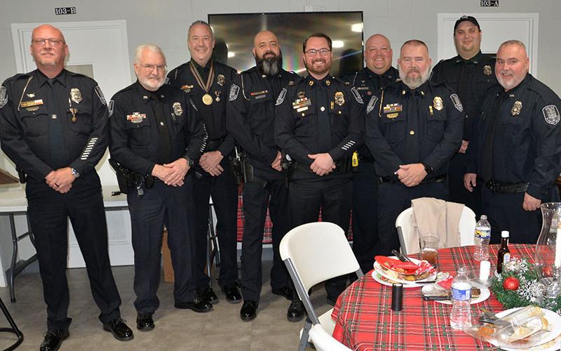 McCaysville police officers gathered for their annual banquet and awards dinner Monday, December 16, at the First Baptist Church of McCaysville/Copperhill. Shown at the conclusion of the event are, from left, Brandon Patterson, Pete Kusek, Nathan Daugherty, Eric Fears, Chief Michael Earley, Brantley Worley, Deputy Chief Cory Collogan, Steve Bennett and Michael Green.