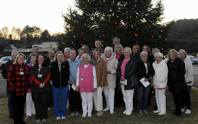 Shown at the Love Lights Tree Lighting ceremony are, from left, front row, Pam Satterfield, Bridgette Young, Jessica Thomason, Maureen Dalziel, Shirley Copeland, Natalie Hicks, Carole Thomas, Joyce Mitchell, Margaret Matthews, Laura Haight, Cindy Hicks and Carol Green; second row, left, Steve Cheatham, Barbara Cheatham, Lamanda Prince, Jean Bonnewitz, Rev. Carol Wade, Susan Kiker, Carmen Clines, Julie Shirah and Gilita Carter; third row, left, Amy Gill, Evelyn Hammond, Daniel Postell and Tim Snider.