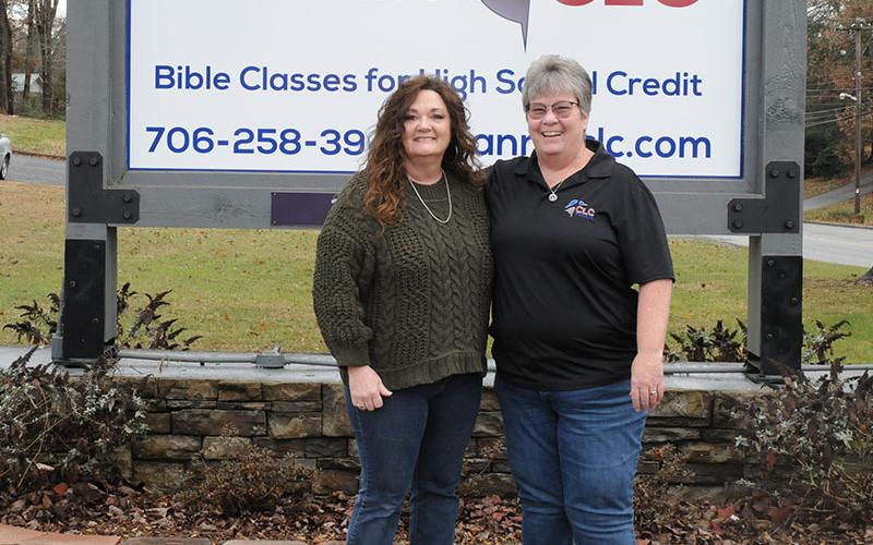 Fannin Christian Learning Center (CLC) Office Manager Alyssa Hooper, left, and Executive Director Tina Lee stand before the CLC sign.