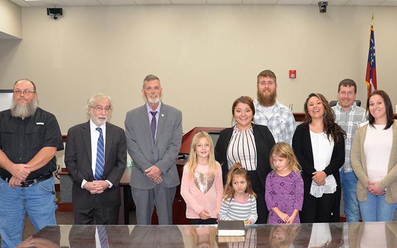 Carissa Monroe, a new Magistrate Court clerk, was among those sworn into the court system during a special ceremony Friday morning, December 13, at the Fannin County Courthouse. She is shown with her family, from left, front, Chevy, Kami and Remi Monroe, and, back, Carissa, Brian Monroe, Briana Monroe, Justin Monroe and Courtney Laberge.