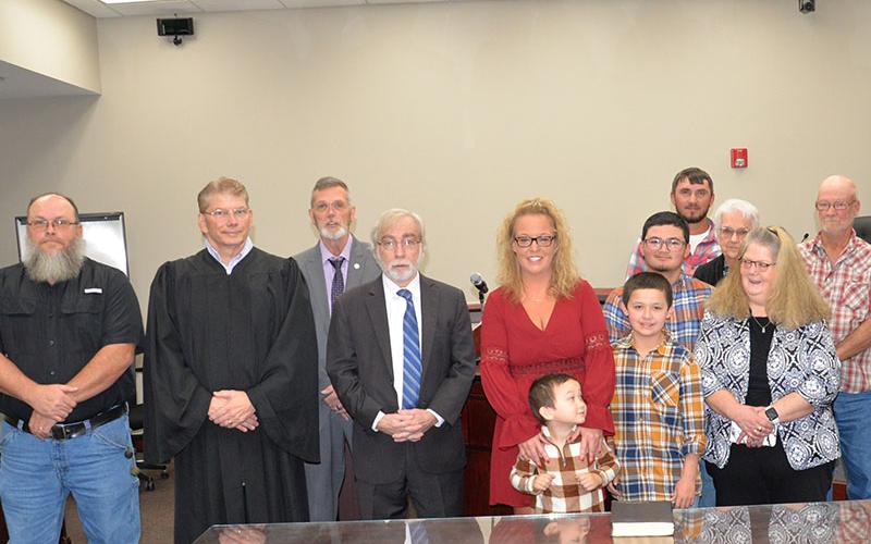 Cassie Magallanes, the new chief clerk in Fannin County Magistrate Court, was among several court system officials taking their oaths of office Friday. Shown are, from left, Magistrate Judge Kevin Dye, Probate Judge Scott Kiker who performed some of the swearing in ceremonies, Chief Magistrate Judge Brian Jones, Senior Magistrate Judge and Assistant Probate Judge James Altman, Magallanes and her family, Jacob Magallanes, Kolby Magallanes, Trey Magallanes, Brandon Rymer, Shirley Weaver, Gwen Weaver and Larry
