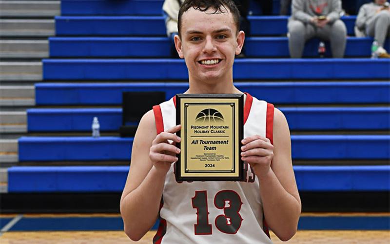 Copper Basin’s Carder Lance holds his All Tournament Team award.