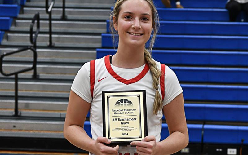 Copper Basin’s Alexis Hyatt holds her All Tournament Team award.