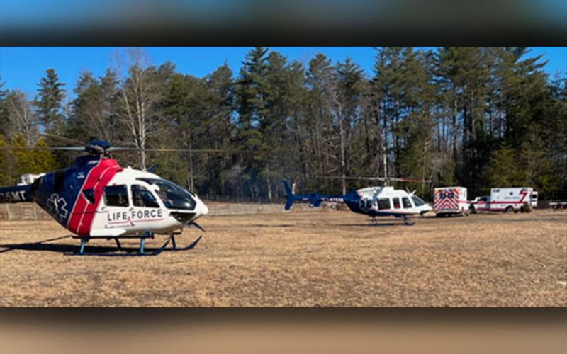 Two Lifeforce helicopters prepare to transport the victims of a house fire in the Doublehead Gap Road area. Despite the remote location, the first firefighters arrived on the scene in 11 minutes.