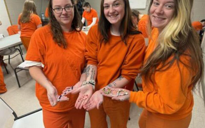 Kayla Sylvester, Emilie Bolling and Hallie Thomason, from left, show off some of the bracelets they have just finished making that will accompany members of The Ridge Community Church on a mission trip to the Dominican Republic.