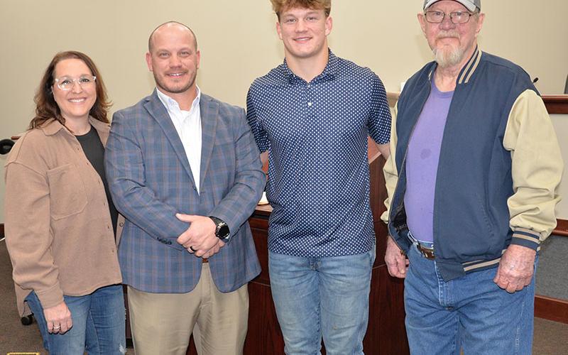 Adam Born, second from left, took his oath of office Friday afternoon as a new school board member for Fannin County. Following the ceremony, he is shown with members of his family, from left, Nicole Born, Cooper Born and Inman Born.