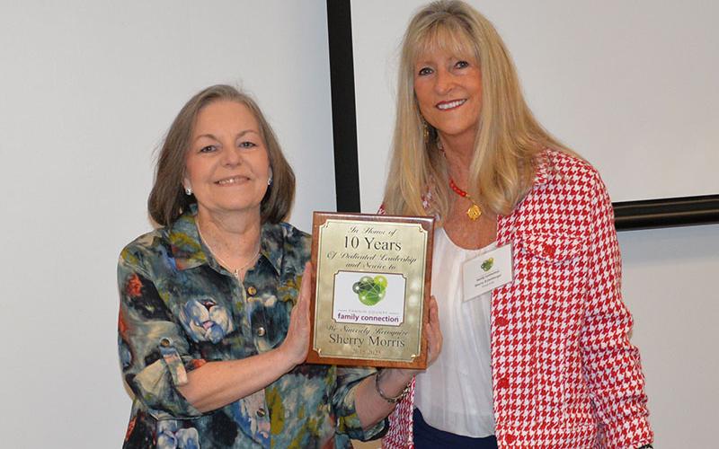 Sherry Morris, left, was recognized for her years of service to Fannin County Family Connection during a Saturday reception. She was presented a plaque by Family Connection Board Chair Sherry Echelberger.