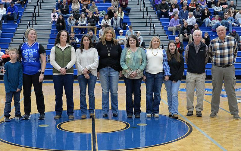 The 1995-1996 Lady Rebels basketball team will be inducted into the Fannin County Sports Hall of Fame this spring. The honor was announced Saturday between Fannin County’s basketball games against Union County. Present for the recognition were, from left, Katie Collins Taylor and her son Henry, Ashley Herendon Weeks, Melissa Holler Patton, Leslie Jabaley Mann, Kim Jones Ware, Roxie Reed Travato and her Daughter Riley, Coach Eddie Payne and Head Coach Johnny Farmer.