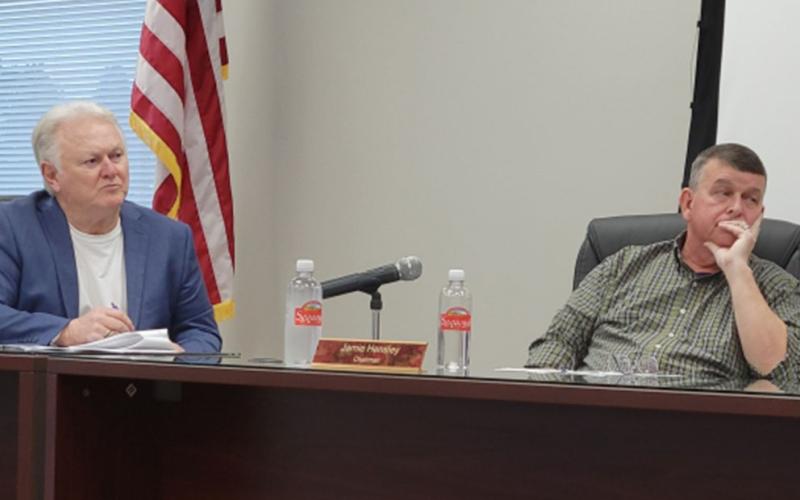 Fannin County Post 1 Commissioner Johnny Scearce, left, and Commission Chairman Jamie Hensley listen as Chief Tax Appraiser Dawn Cochran explains Georgia House Bill 581 during a workshop Tuesday, December 17.