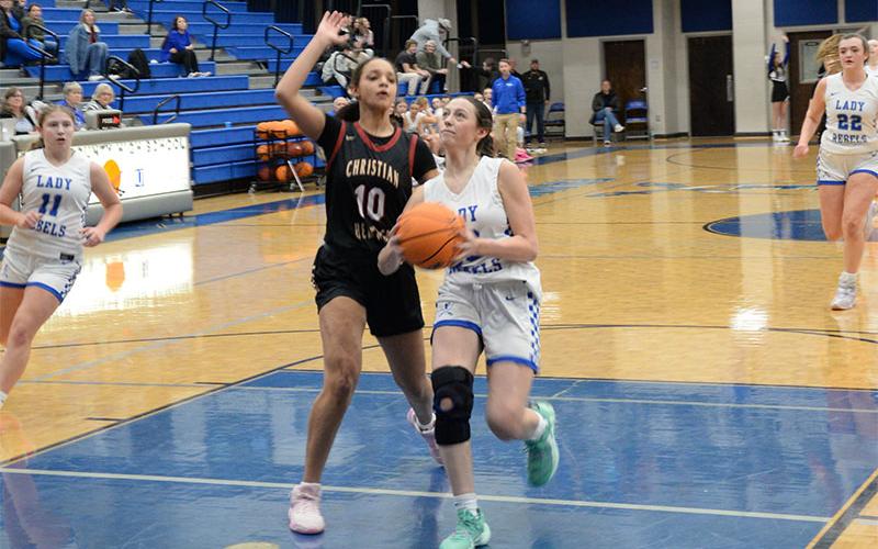 Avi Ethington drives the lane on the way to scoring two points for the Fannin County Lady Rebels.