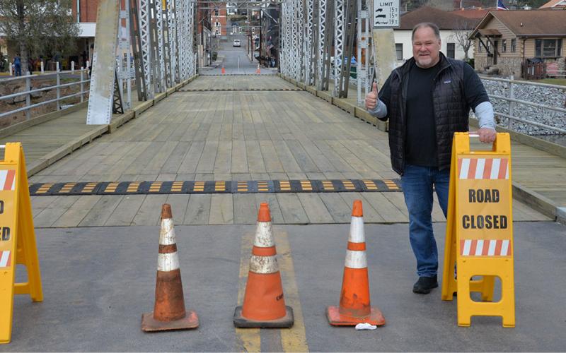 Mike Galinski, owner of the Riverwalk Shops complex, was all thumbs up when the iconic steel bridge spanning the Toccoa River and connecting the twin cities of McCaysville and Copperhill was re-opened after extensive repairs.