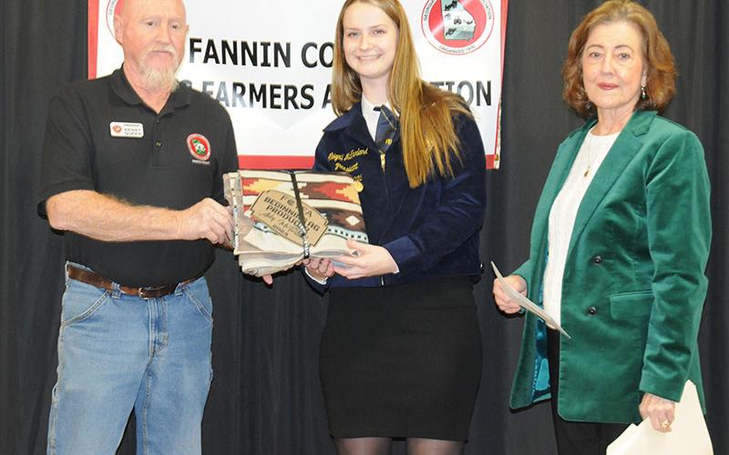 Abby McFarland, center, is recognized as the Beginner Agriculture Producer during the Fannin County Young Farmers Association’s Awards Banquet Friday, January 24. With McFarland are association President Kenny Queen and Kathy Beck of the North Georgia Master Gardeners.