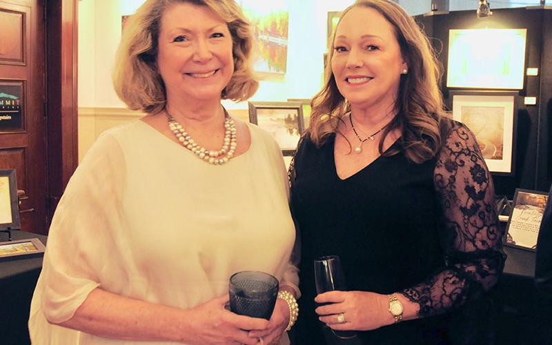 North Georgia Mountain Crisis Network Executive Director Barbara Honaker, left, and Anna Bradley mingle during the organization’s Love, Honor, Cherish Gala.
